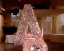 Hand carved letters with a red light steals the show from Louisville Ice Sculptures. Price $275