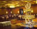 Food display ice sculpture with tiers and a topper.